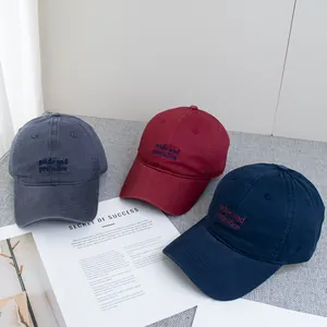 Classic cotton baseball cap set in grey, red, and blue with custom embroidery