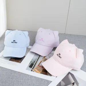 Pastel baseball caps with cat ears and M NIU NIU embroidery in blue, pink, and purple