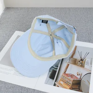 Close-up of the inner lining and adjustable strap of the light blue cat ear baseball cap