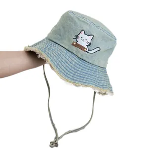 Light blue washed denim bucket hat with cute cat embroidery and frayed edges