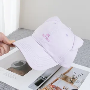 Detail of light purple baseball cap with 3D cat ears and NIU NIU embroidery