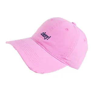 Pink cotton baseball cap with blue okey embroidery and distressed brim details