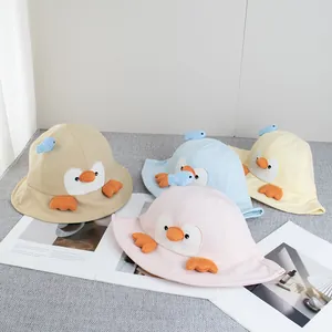 Cute cartoon penguin bucket hat for kids in pink, yellow, blue, and khaki colors