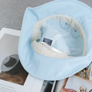 Light blue cartoon penguin bucket hat with breathable mesh lining and soft cotton fabric