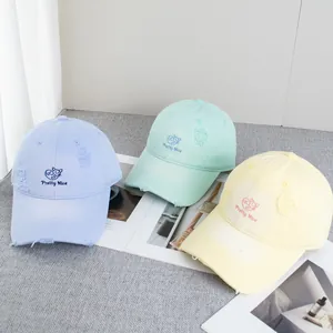 Pastel baseball caps with embroidered kittens and distressed ripped details in three colors
