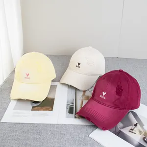 Distressed baseball cap with heart embroidery in yellow, beige and burgundy colors
