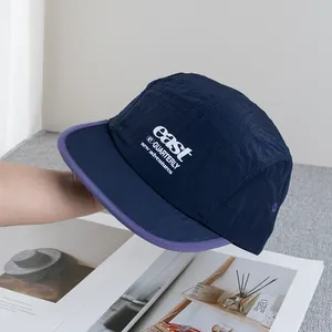 Detailed texture of lightweight ripstop nylon camping hat with embroidered logo
