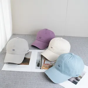 Set of minimalist cotton baseball caps with Art embroidery in four pastel colors