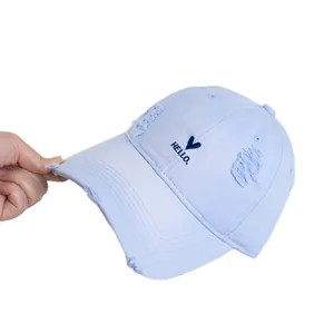 Distressed light blue cotton baseball cap featuring heart embroidery and hello text detail