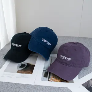 Three washed cotton baseball caps in black, navy, and purple with white embroidery