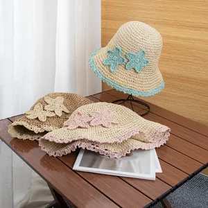 Handmade crochet straw hats with wide wavy brims and star accents for beach vacations