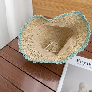 Handwoven straw hat with mint green scalloped lace brim for summer beach sun protection
