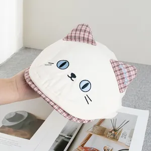 Detailed embroidery of cat face features on a vintage checkered beret for girls