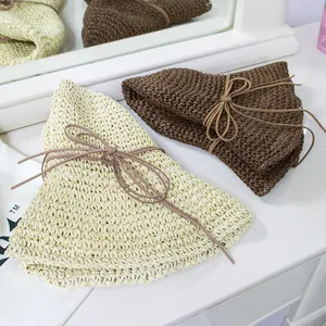 Foldable wide brim straw sun hats for women in beige and brown with bow details