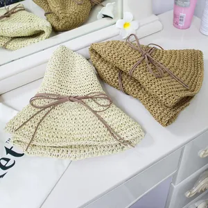 Foldable handmade straw hats in beige and coffee with bow ties for summer beach wear