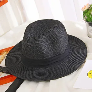Classic black straw fedora sun hat with a matching decorative ribbon for summer beach trips