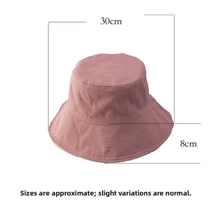 Detail view of cotton bucket hat in dusty pink showing 30cm width and 8cm brim height