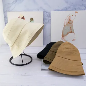 Women's cotton sun hat bucket style with wide brim shown in multiple solid colors