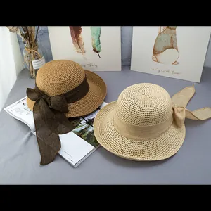 Cappelli da sole in paglia a tesa larga con nastro a fiocco per donne eleganti