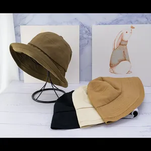 Minimalist solid color sun protection bucket hat in four classic versatile colors