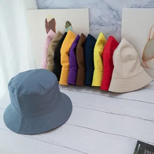 Minimalist double-sided cotton bucket hat in multiple colors with reinforced stitching