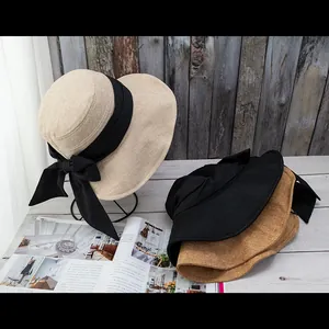 Summer sun hat for women with large bow, foldable straw design for UV protection