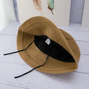 Khaki corduroy bucket hat for women with black lining and adjustable windproof strap