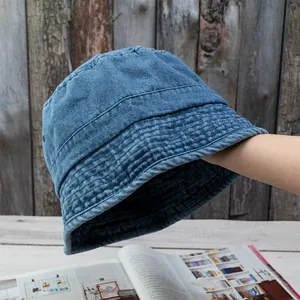 Close-up of vintage washed denim bucket hat with detailed stitching and durable cotton texture