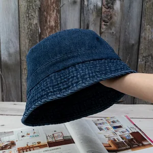 Classic dark blue washed denim bucket hat for women with detailed stitching and retro style