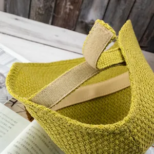 Detail of adjustable velcro strap and sweatband on woven straw sun hat for women