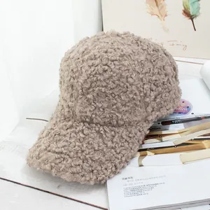 Detailed view of plush khaki teddy fleece texture on a warm winter baseball cap