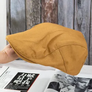 Detailed close-up of ginger yellow cotton ivy cap texture on vintage wooden background