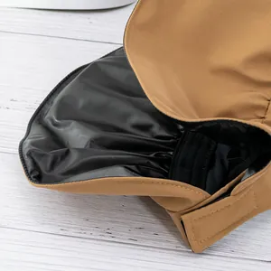 Detail of sun hat with black vinyl lining and elastic band for a secure fit