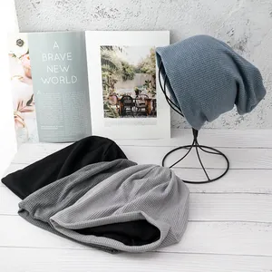 Three colors of waffle knit beanies in blue, grey and black with soft thermal lining