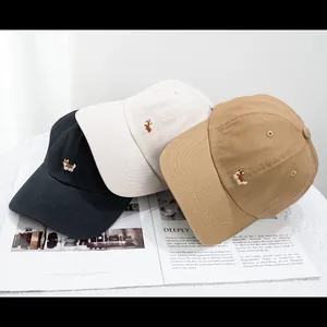 Detailed embroidery of Corgi dogs on cotton baseball caps in black, cream and khaki colors