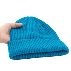 Bright blue ribbed knit beanie hat for winter warmth shown on a white background