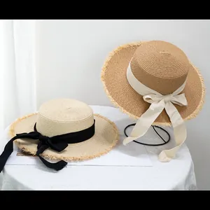 Chapeaux canotiers en paille à bords effilochés avec nœuds en ruban pour l'été