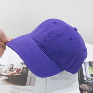 Detail view of purple washed cotton baseball cap featuring reinforced brim stitching