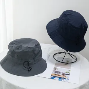 Unisex quick-dry nylon bucket hat with adjustable drawstring and metal air vents for sun protection