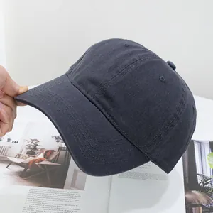 Close-up of dark grey washed cotton baseball cap showing twill fabric and stitching