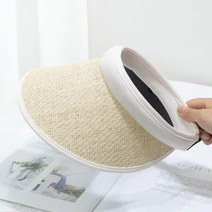 Close-up of natural straw weave texture and cream fabric edge on wide brim sun hat