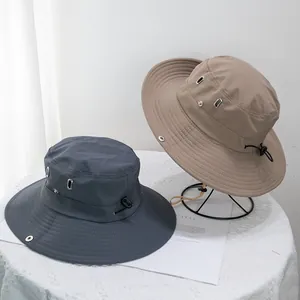 Detail of quick-dry sun hats with wide brims, metal vents, and adjustable drawstrings