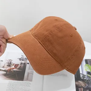Detail of the reinforced stitching on the brim of a solid cotton baseball cap