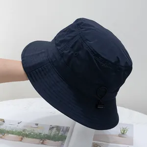 Detail of navy blue quick-dry sun hat showing adjustable drawstring and seam stitching