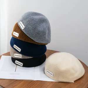 Vintage wool newsboy beret hats in assorted colors with stylish side label for women