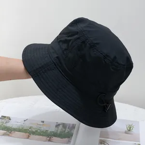 Detail of quick-dry black bucket hat with adjustable drawstring and stitch brim