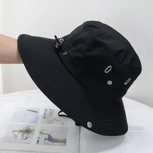 Close-up of black sun hat featuring water-resistant fabric and metal ventilation eyelets