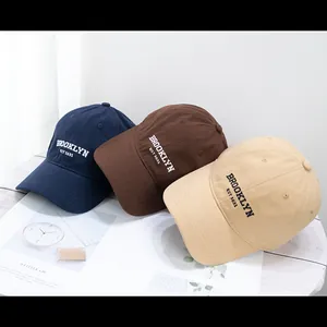 Detailed embroidery of Brooklyn Est 1631 on cotton baseball caps in three classic colors