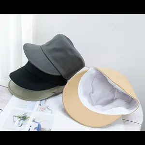 Flat top cotton baker boy hats in assorted colors shown from multiple angles
