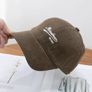 Detail of brown brushed cotton baseball cap with white Missebear 1987 embroidery